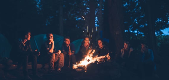 People around campfire at night